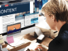 Conversion Content: Crafting Content That Moves Prospects from Attention to Action Business professional reviewing digital content on a desktop screen, illustrating a conversion-driven content strategy that supports decision-making, trust, and buyer readiness.