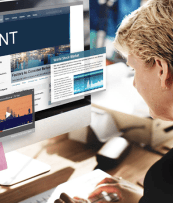 Conversion Content: Crafting Content That Moves Prospects from Attention to Action Business professional reviewing digital content on a desktop screen, illustrating a conversion-driven content strategy that supports decision-making, trust, and buyer readiness.